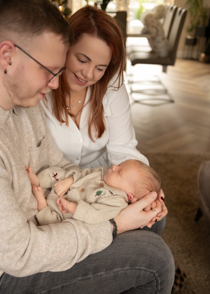 Home newborn photography in Ayrshire capturing a natural family moment with newborn at home
