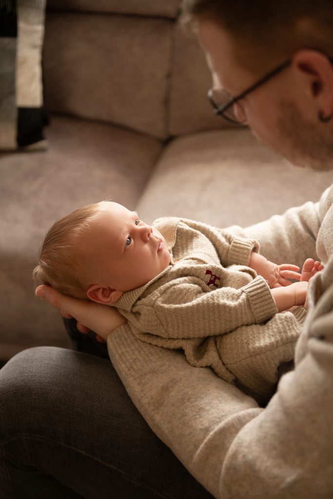 Home newborn photography in Ayrshire capturing a sleeping newborn baby in natural light