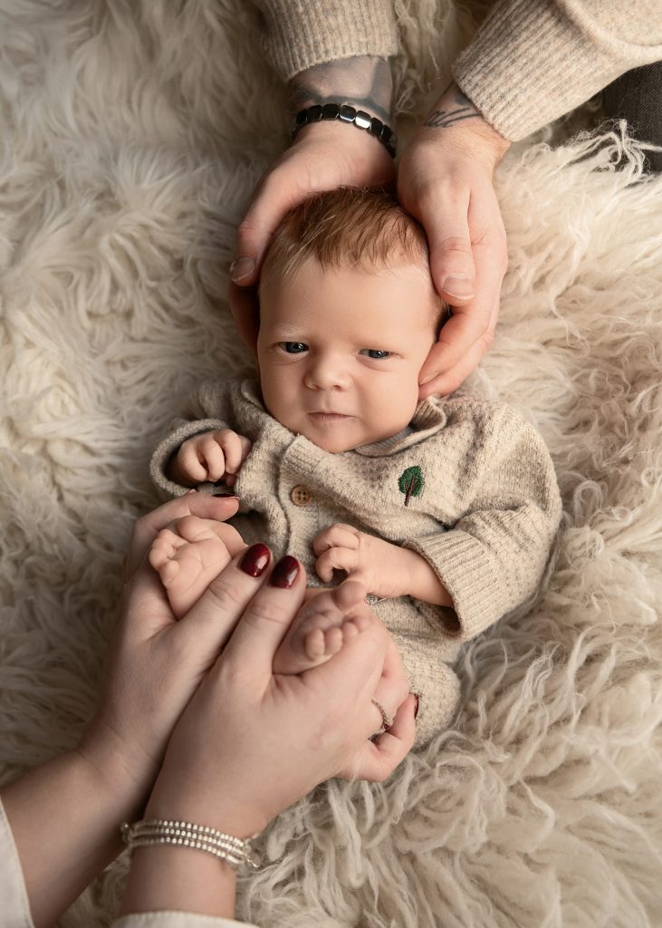 Home newborn photography in Ayrshire capturing tiny newborn details hands and feet